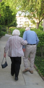Caregiver of the Month Bob Roney walking with his wife